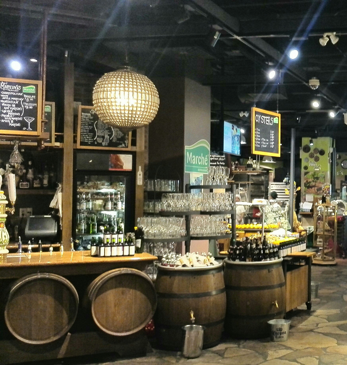 Cafe bar with barrels at Marche Movenpick Toronto